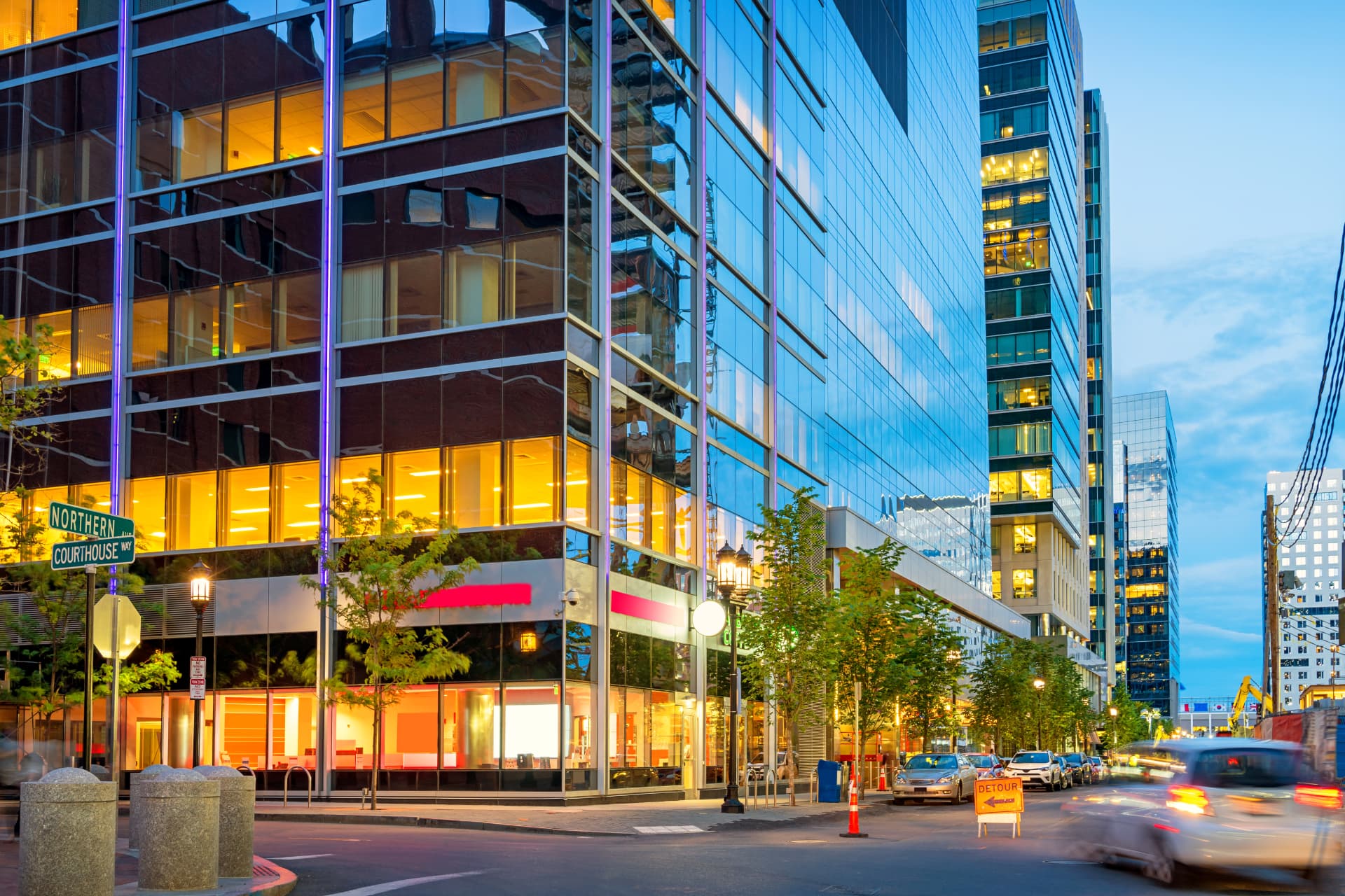 Downtown office towers lit at dusk