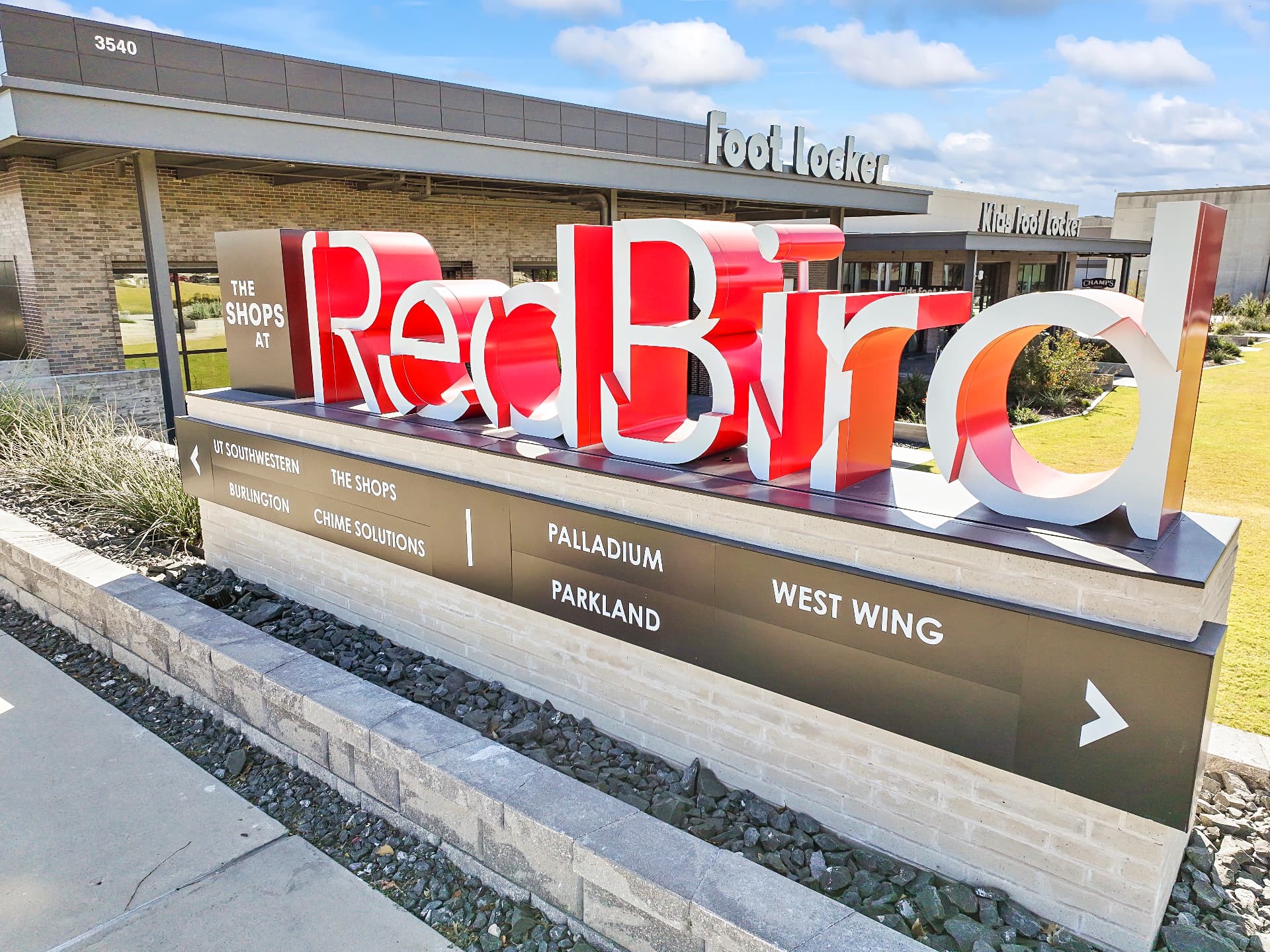 The Shops at RedBird monument sign at the redeveloped retail district